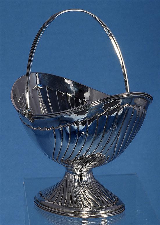 A Victorian silver oval boat shaped sugar basket, by John Newton Mappin, height over handle 172mm, weight